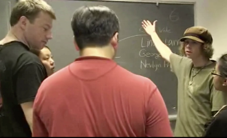 Person presenting at the blackboard